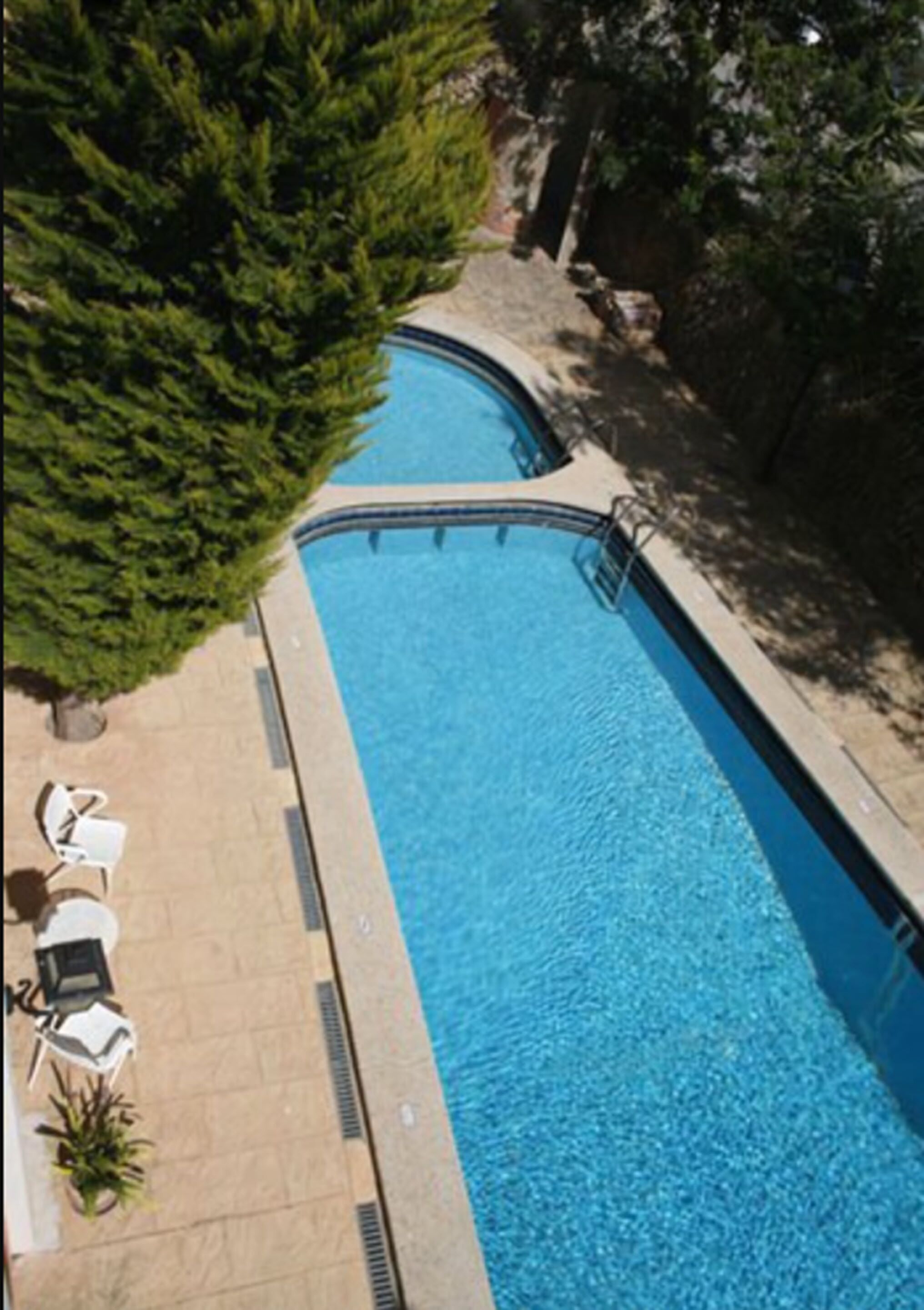 outdoor pool, pool umbrellas, pool loungers