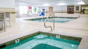 A swimming pool area with a hot tub, lounge chairs, and a sunbed. - Country Inn & Suites by Radisson, Richmond West at I-64, VA (Richmond)