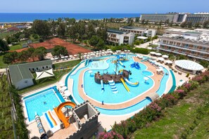 A resort with a large swimming pool, a water park, and a tennis court. - Club Kastalia Holiday Village - All Inclusive (Alanya)