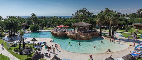 Indoor pool, pool umbrellas, pool loungers