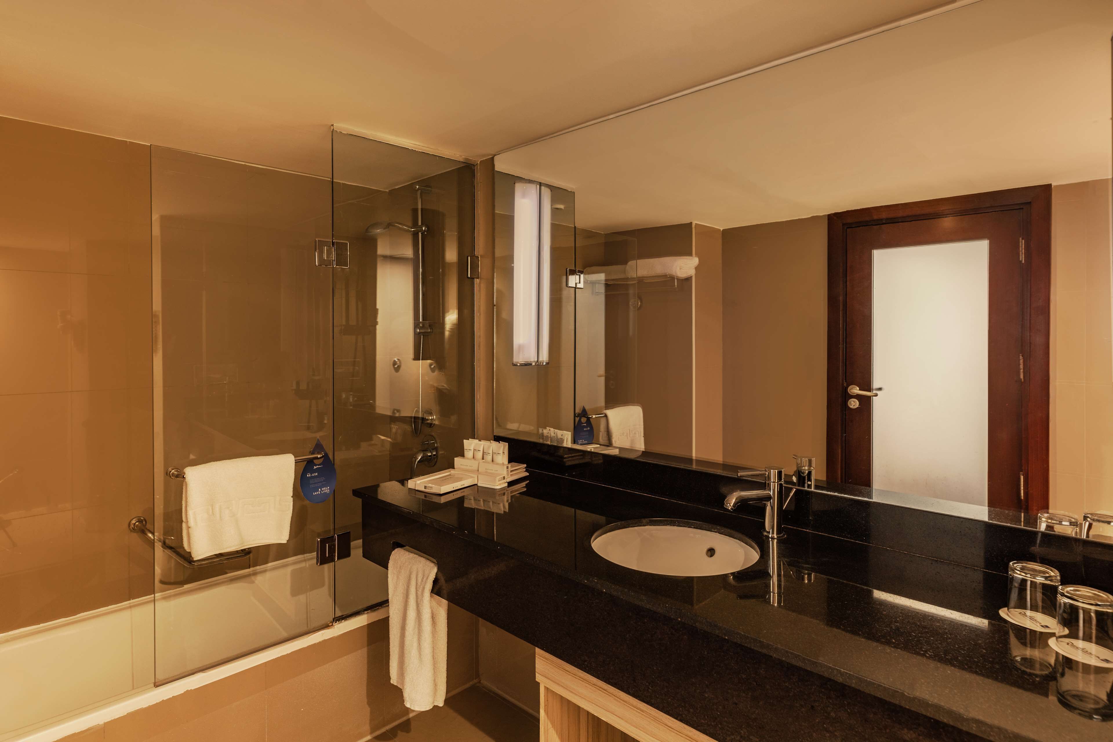 executive suite with lounge access | bathroom | combined shower/bathtub, designer toiletries, hair dryer, bathrobes