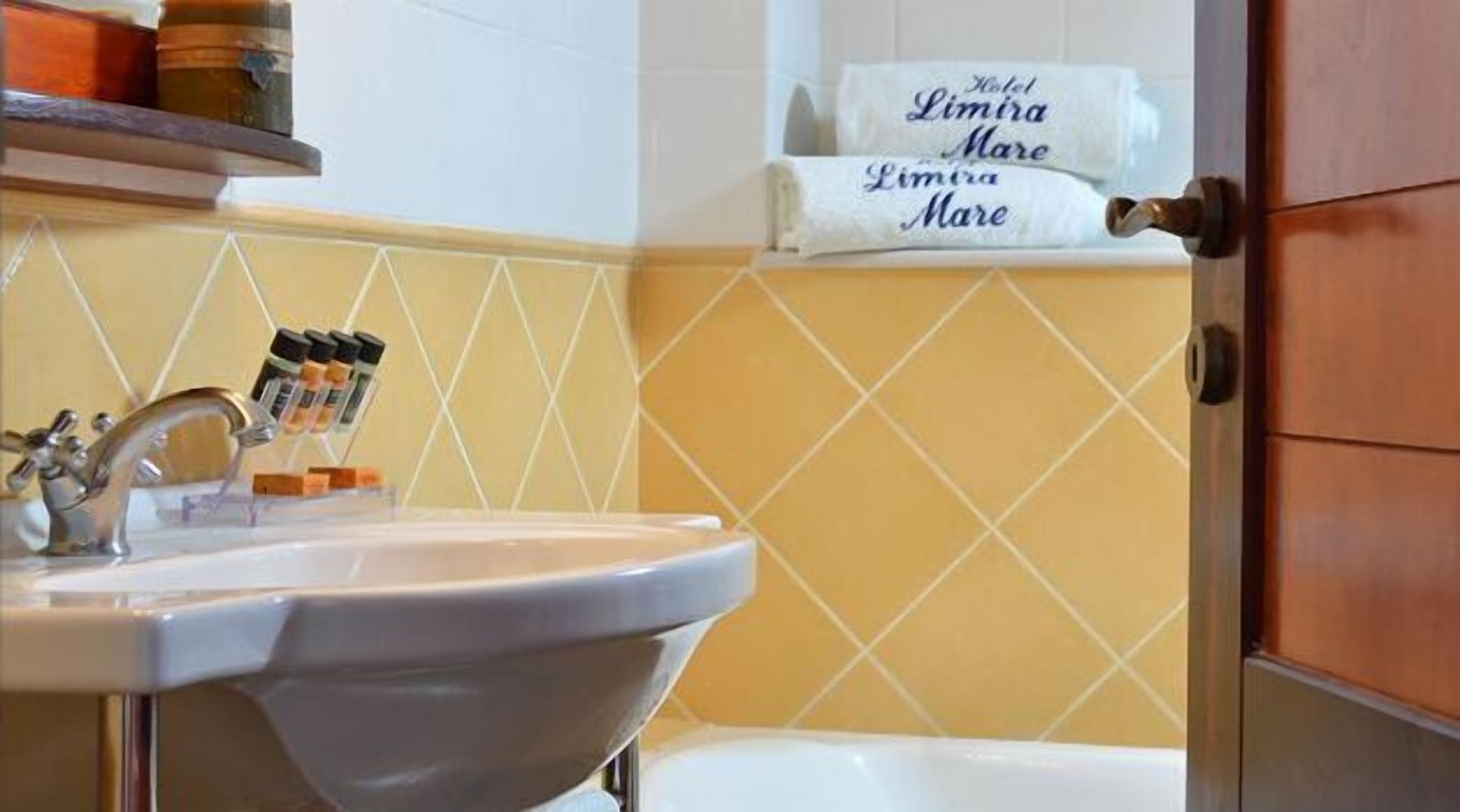 bathtub, deep-soaking bathtub, designer toiletries, towels