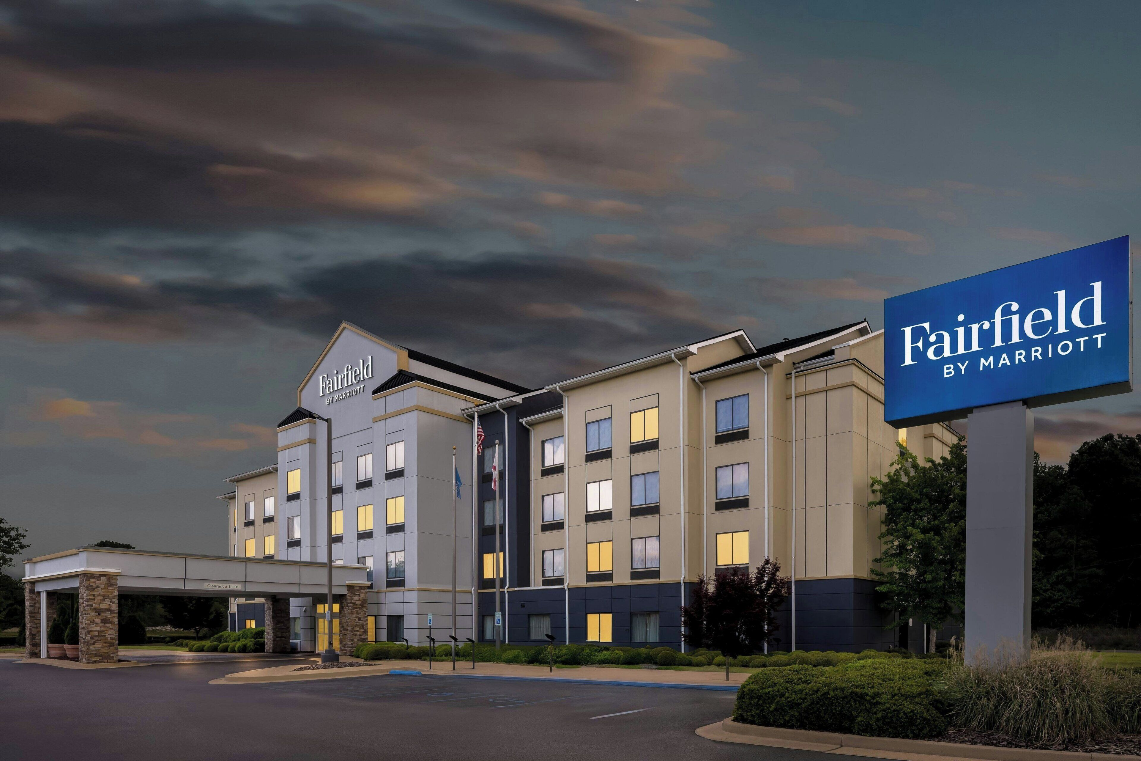 A Fairfield by Marriott hotel with a modern design, multiple floors, and a covered entrance.