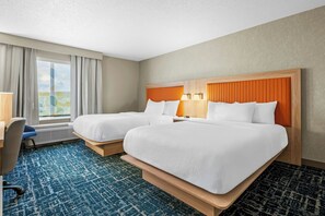 A hotel room with two beds, a desk, and a window with curtains. - Fairfield Inn & Suites by Marriott Gadsden (Gadsden)