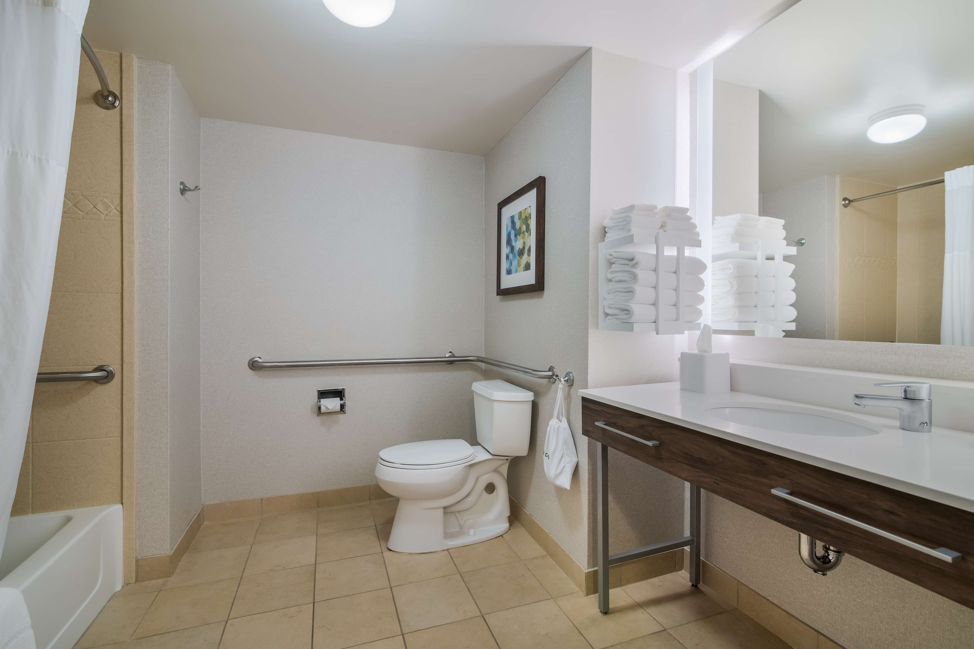 mobility accessible king standard room | bathroom | free toiletries, hair dryer, towels