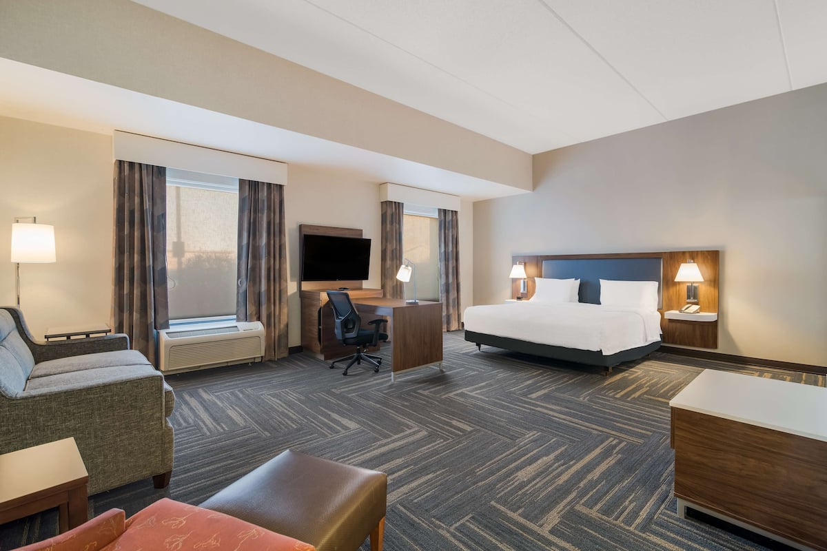 Mobility Accessible King Studio Suite | Premium bedding, desk, blackout drapes, iron/ironing board
