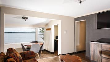 Desk, laptop workspace, blackout drapes, iron/ironing board