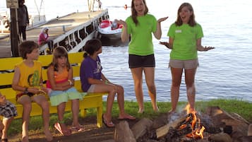 Gather around the campfire and enjoy the serene lakeside setting.
