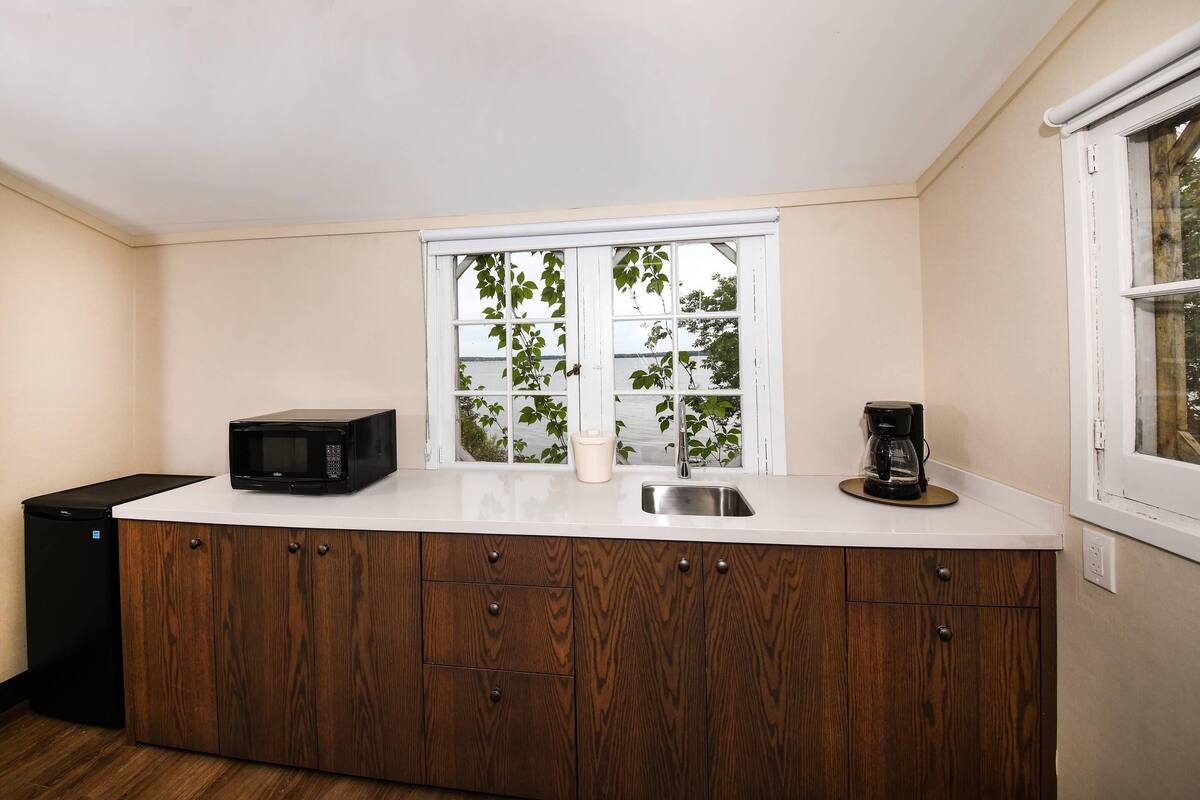 desk, laptop workspace, blackout curtains, iron/ironing board