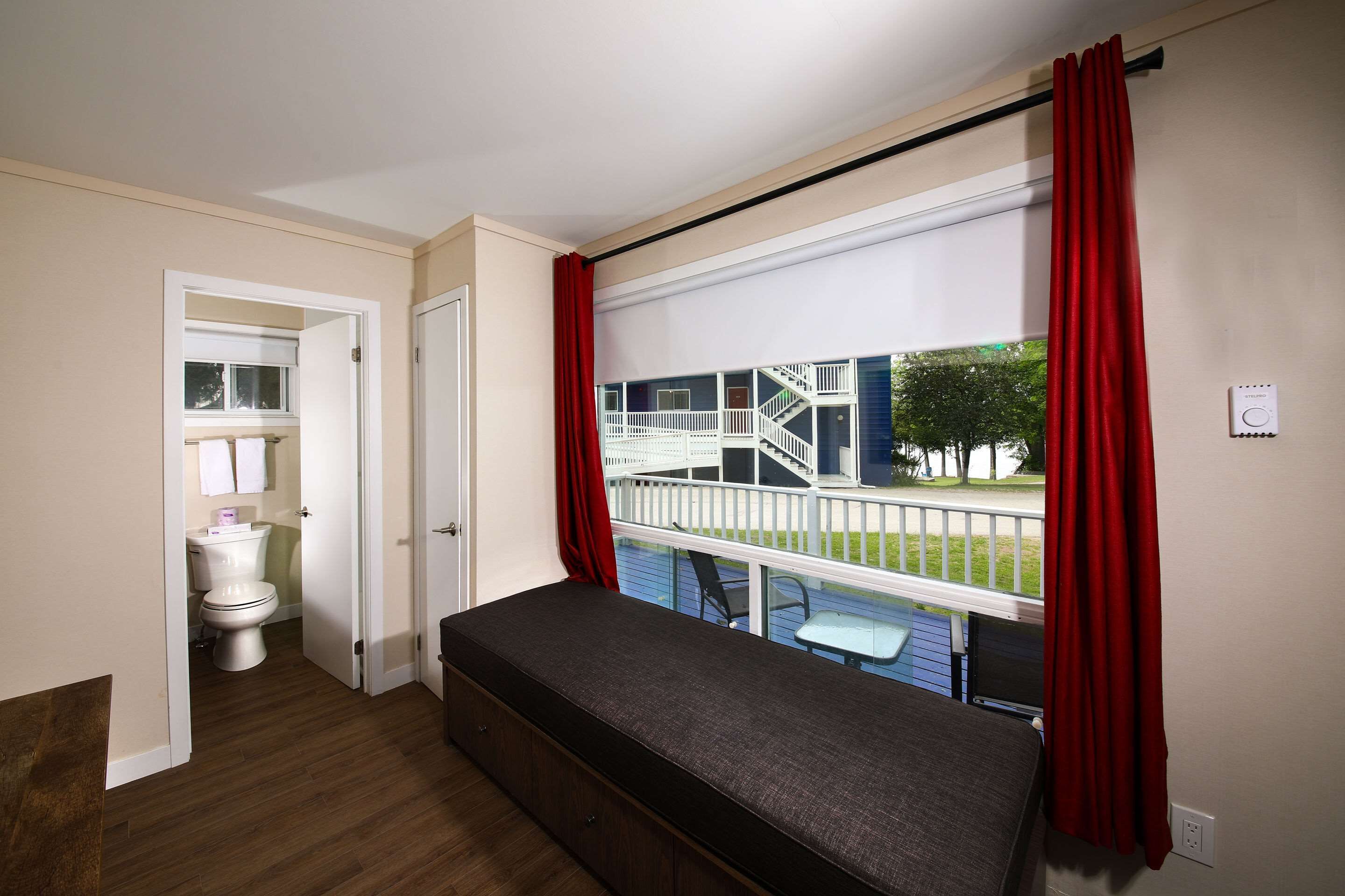 desk, laptop workspace, blackout curtains, iron/ironing board