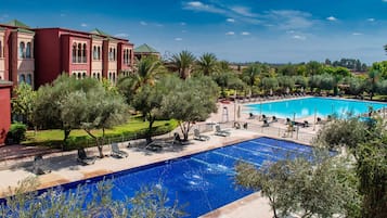 Indoor pool, 3 outdoor pools, open 9:00 AM to 6:00 PM, pool umbrellas