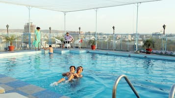 Indoor pool, outdoor pool, pool umbrellas, pool loungers