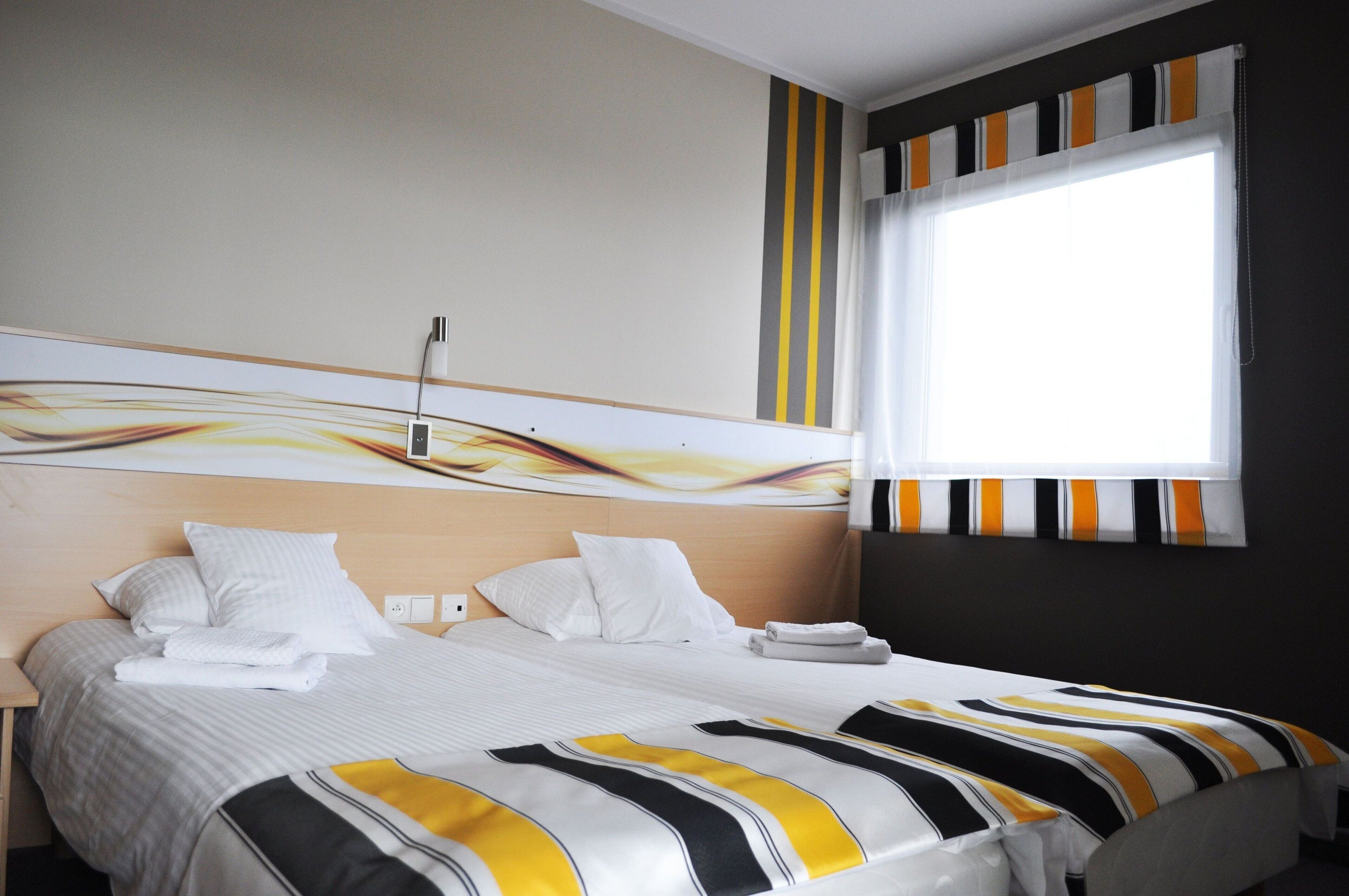 Premium bedding, desk, blackout drapes, iron/ironing board