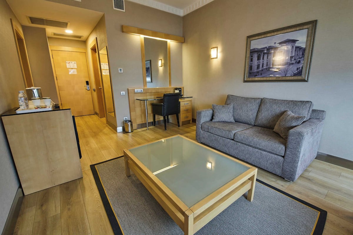 junior suite | living area | 40-inch lcd tv with satellite channels, tv