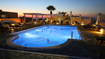 Outdoor pool, open 9:30 AM to 8:30 PM, pool umbrellas, pool loungers