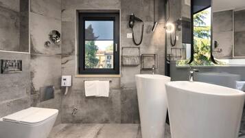 Combined shower/tub, free toiletries, hair dryer, slippers