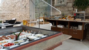 A buffet area with various food items and a coffee station. - Hotel Cittar (Novigrad)