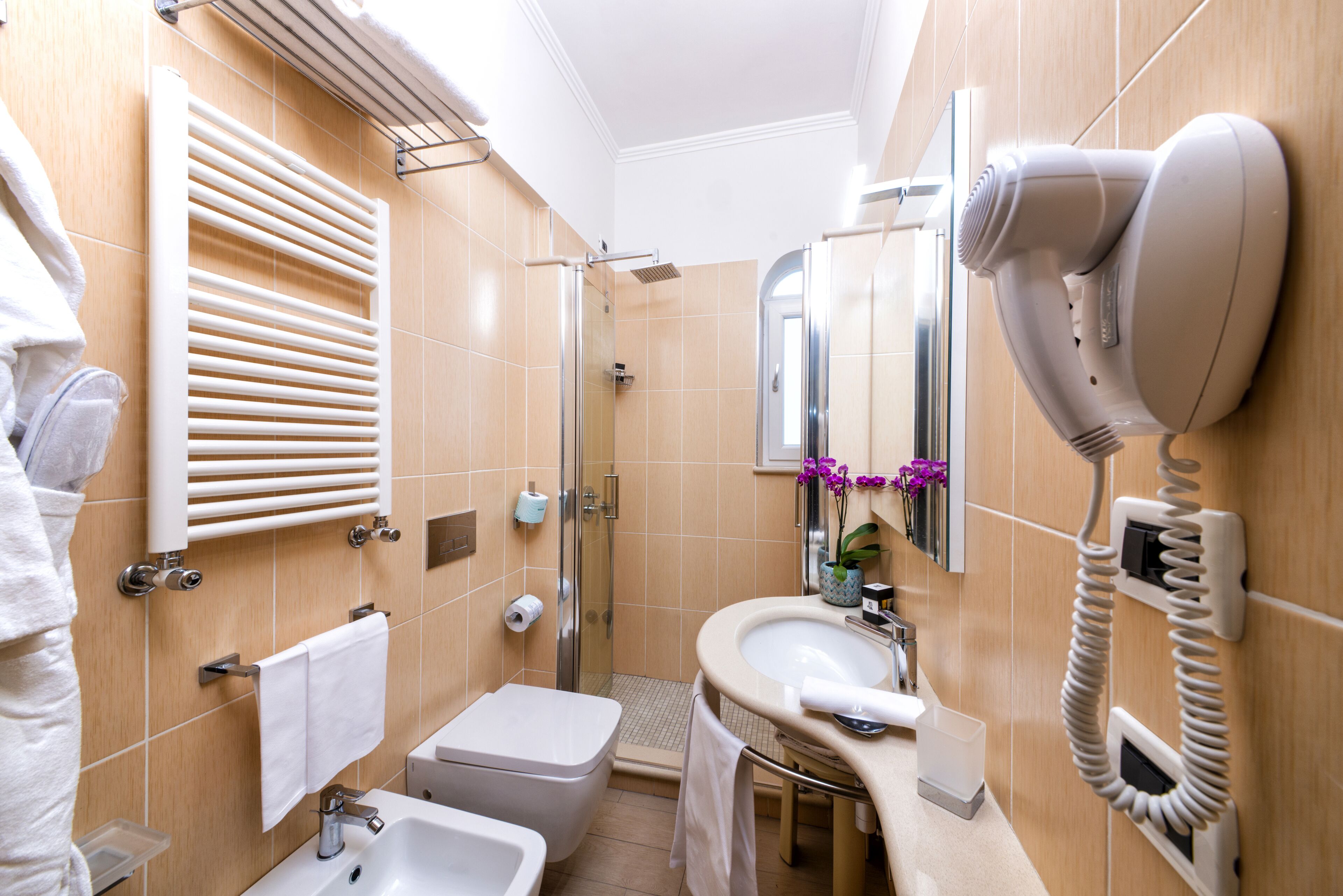 classic double room | bathroom | eco-friendly toiletries, slippers, bidet, towels