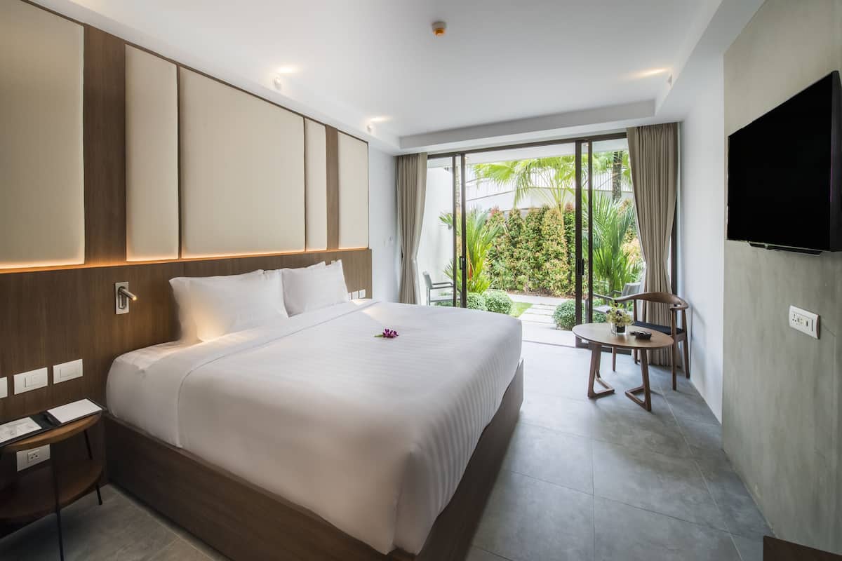 Kamar Double atau Twin Deluks, pemandangan kebun | 1 kamar tidur, minibar, brankas, dan meja kerja