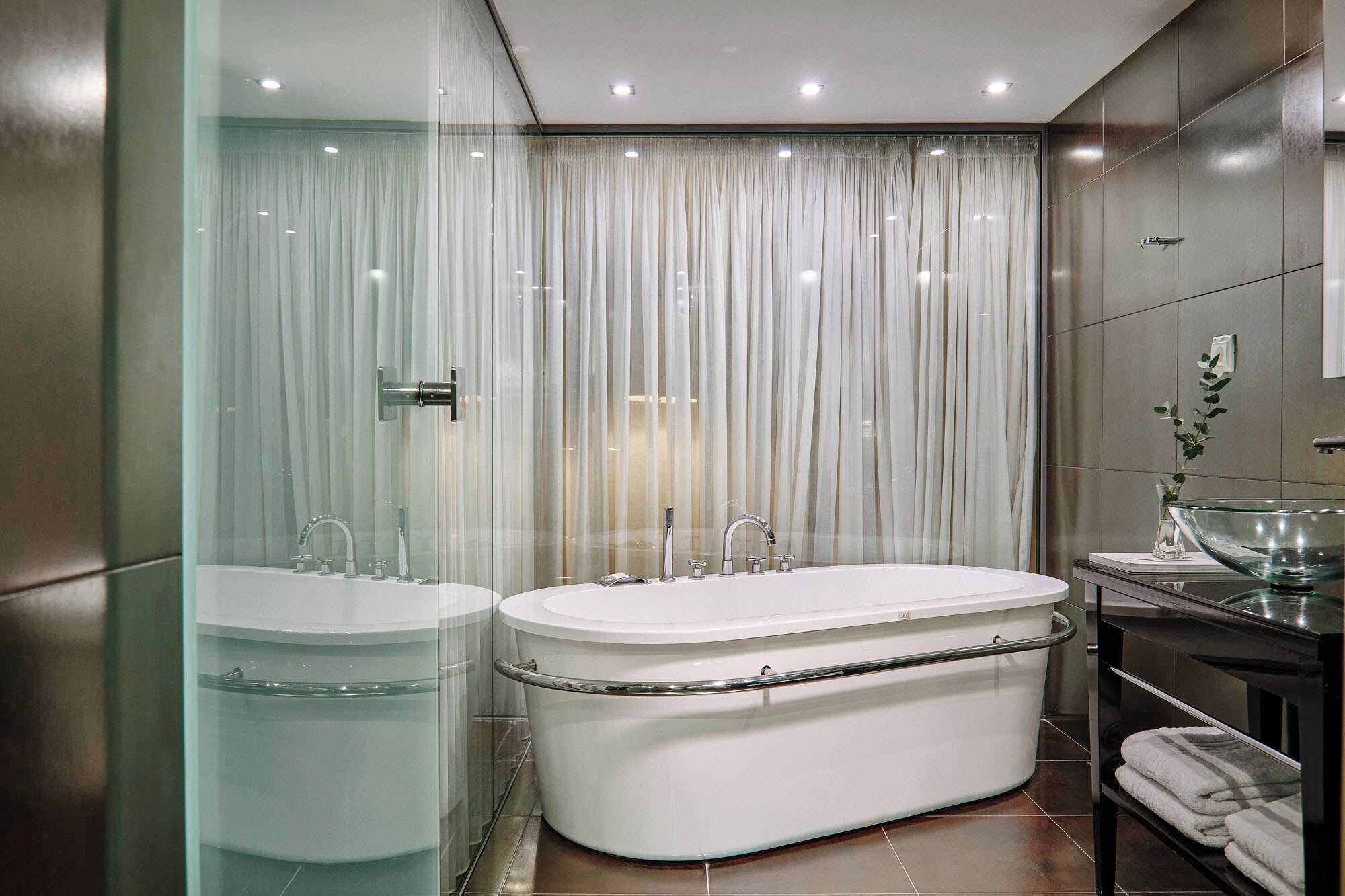 junior suite | bathroom | rainfall showerhead, free toiletries, hair dryer, bathrobes