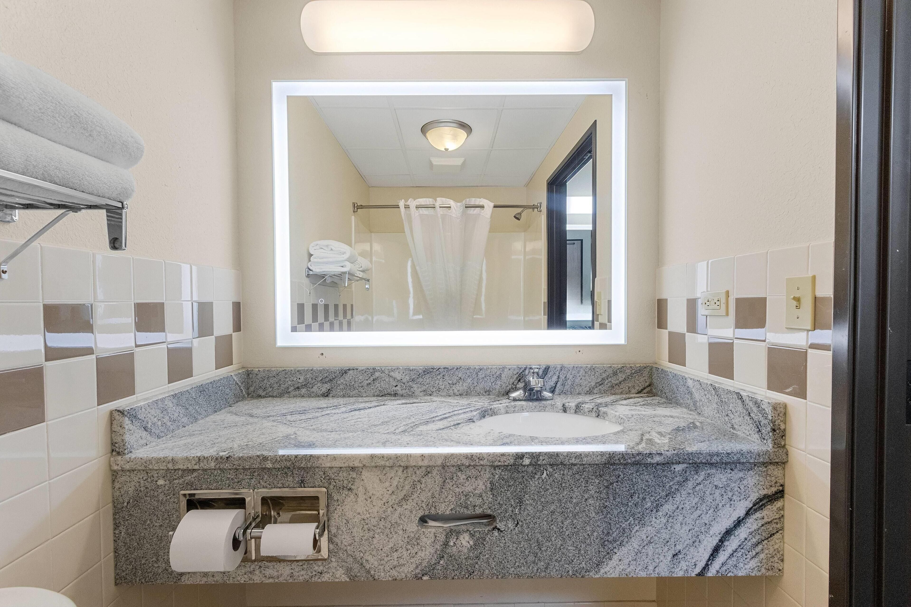 studio suite, 1 king bed, non smoking | bathroom | hair dryer, towels