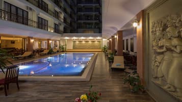 2 outdoor pools, open 10:00 AM to 10:00 PM, pool umbrellas
