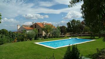 Seasonal outdoor pool, pool loungers