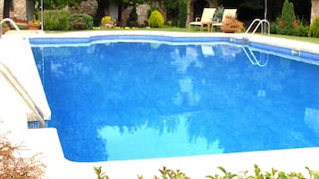 Seasonal outdoor pool, pool loungers