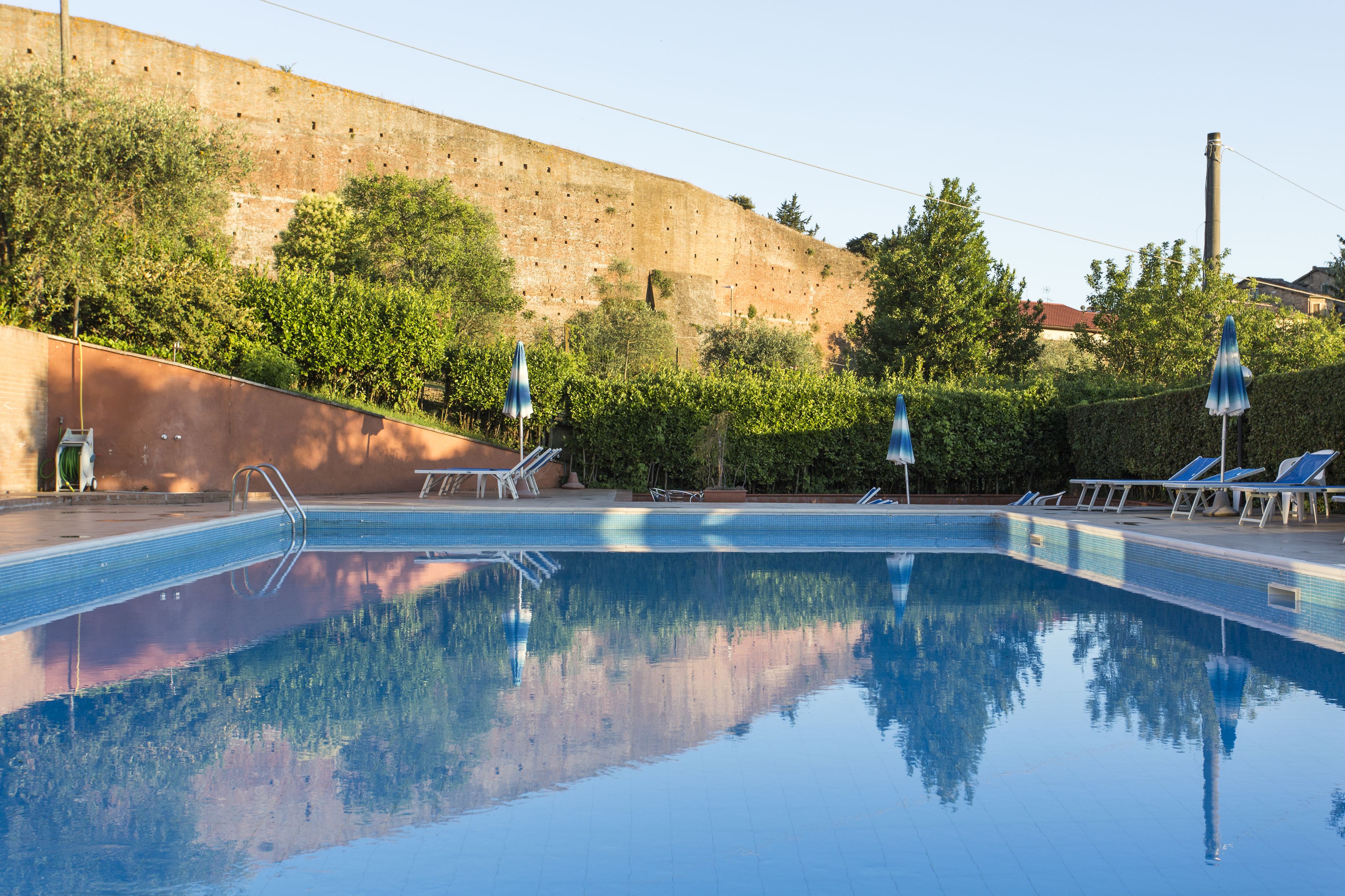 seasonal outdoor pool, open 9:00 am to 6:00 pm, pool umbrellas