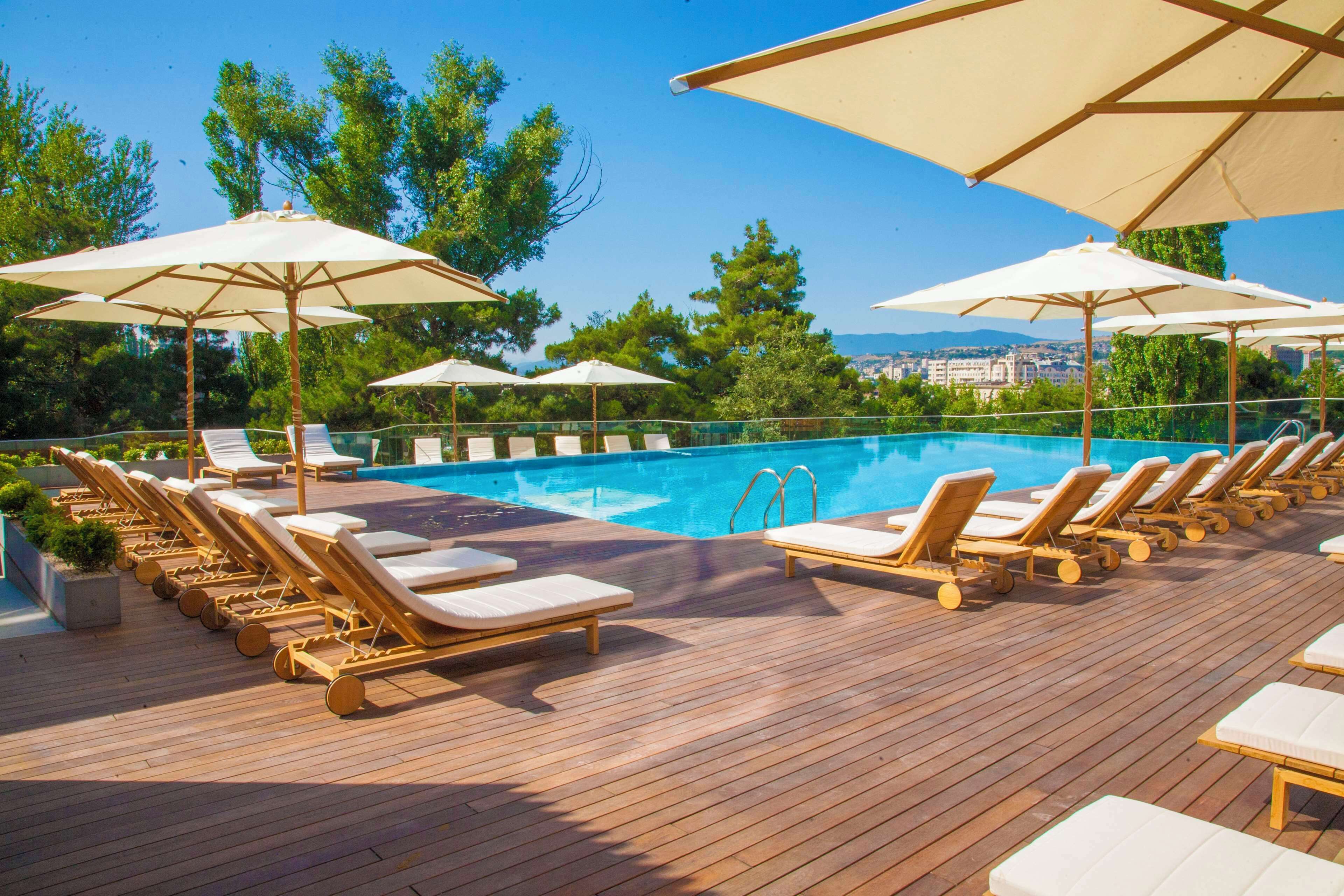 indoor pool, outdoor pool, pool loungers