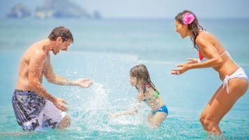 Guests can enjoy a refreshing swim in the pool overlooking the calm sea.