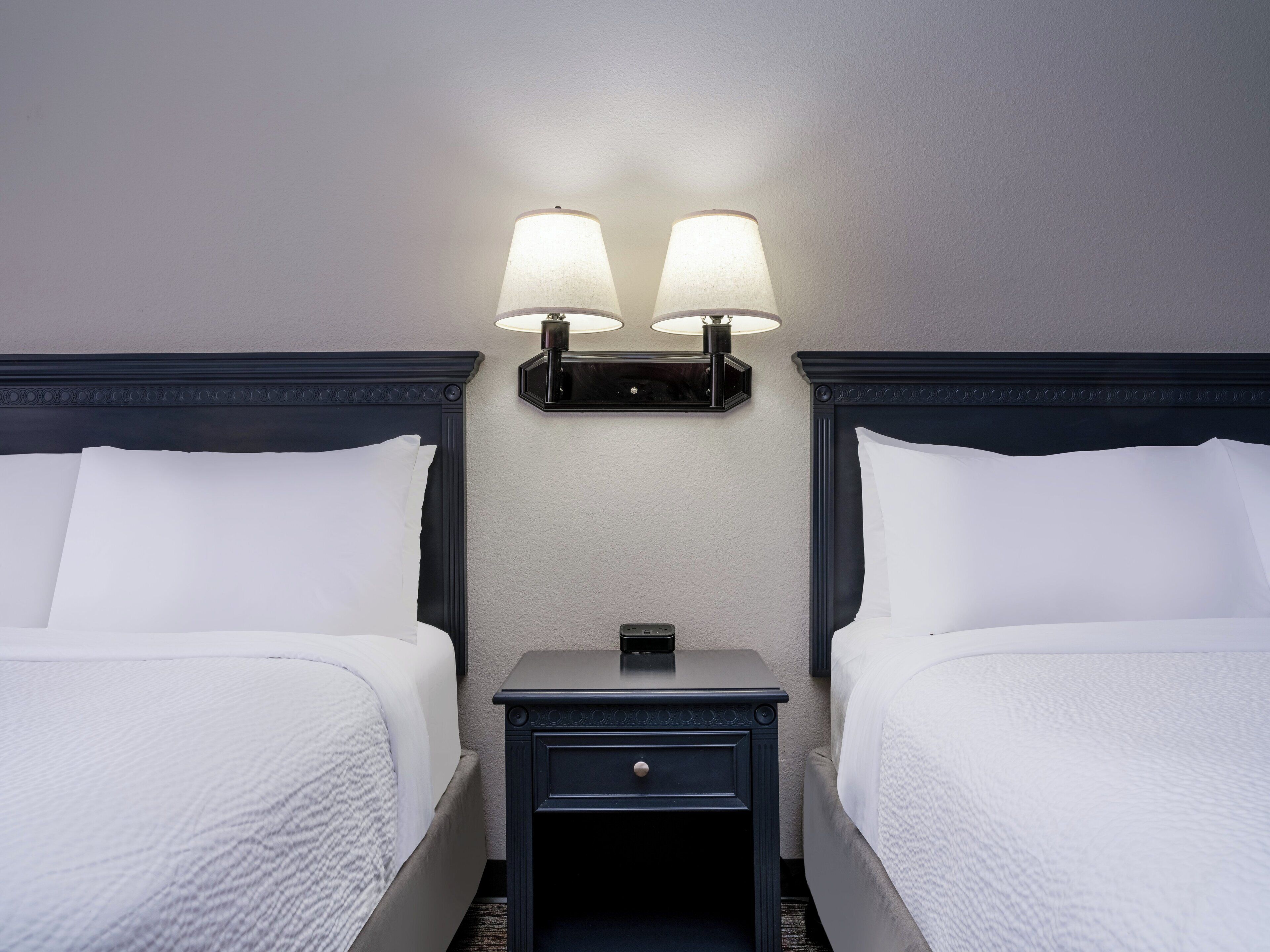 premium bedding, pillow-top beds, desk, blackout curtains