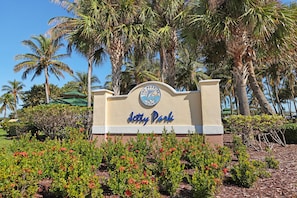 Welcome to The Sunset at Jetty Park, surrounded by lush greenery and tropical ambiance.