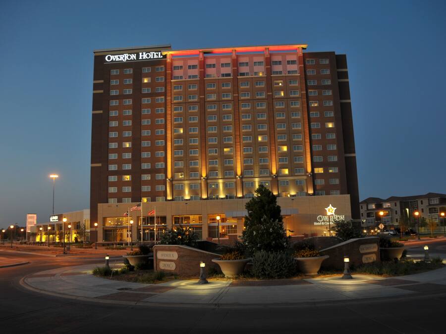 A multi-story hotel with a prominent sign at the top.
