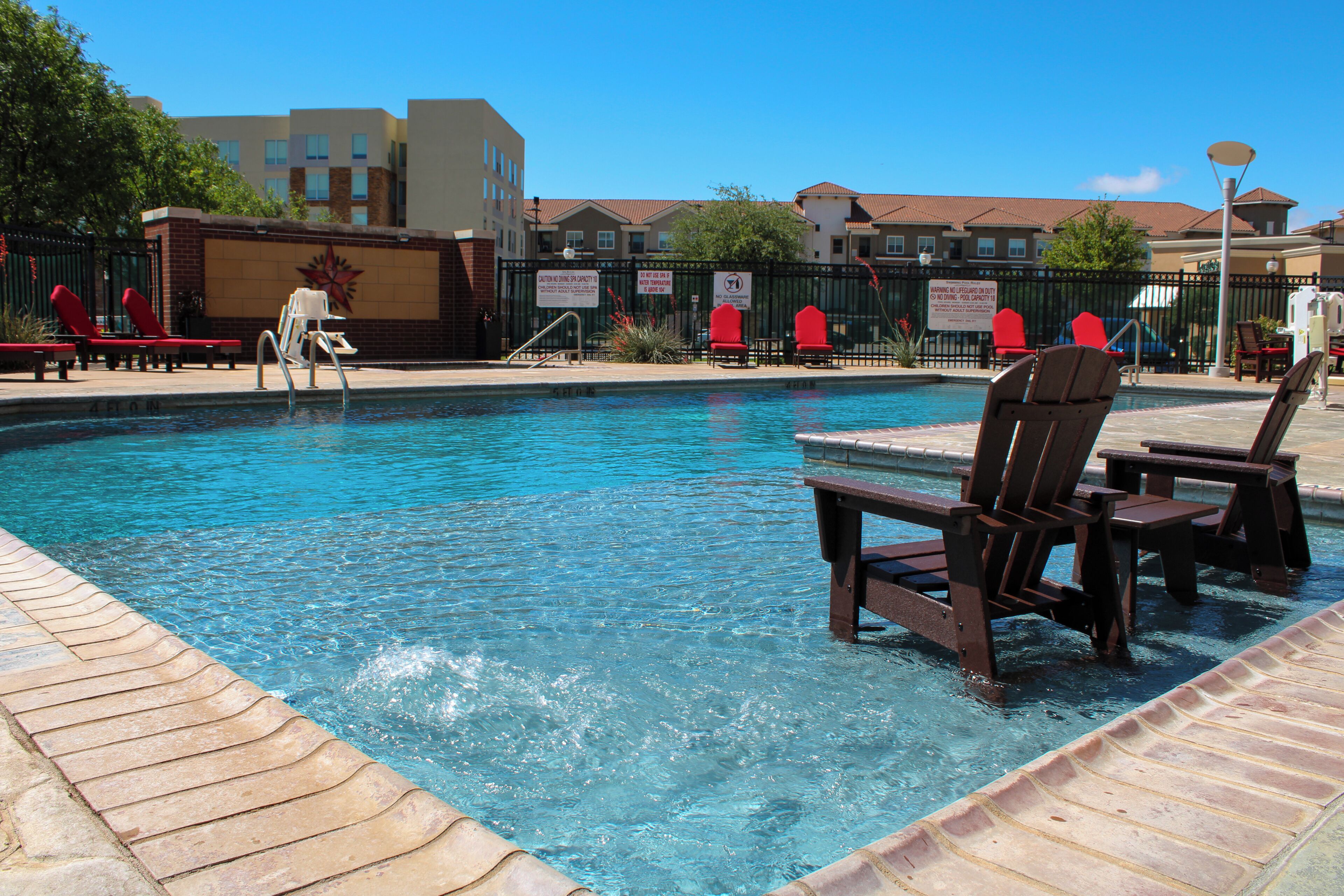 Outdoor pool, open 7:00 AM to 10:00 PM, pool loungers