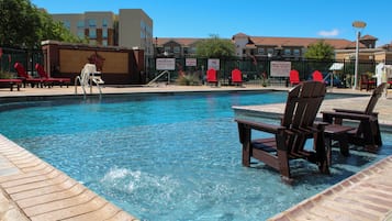 Outdoor pool, open 7:00 AM to 10:00 PM, pool loungers