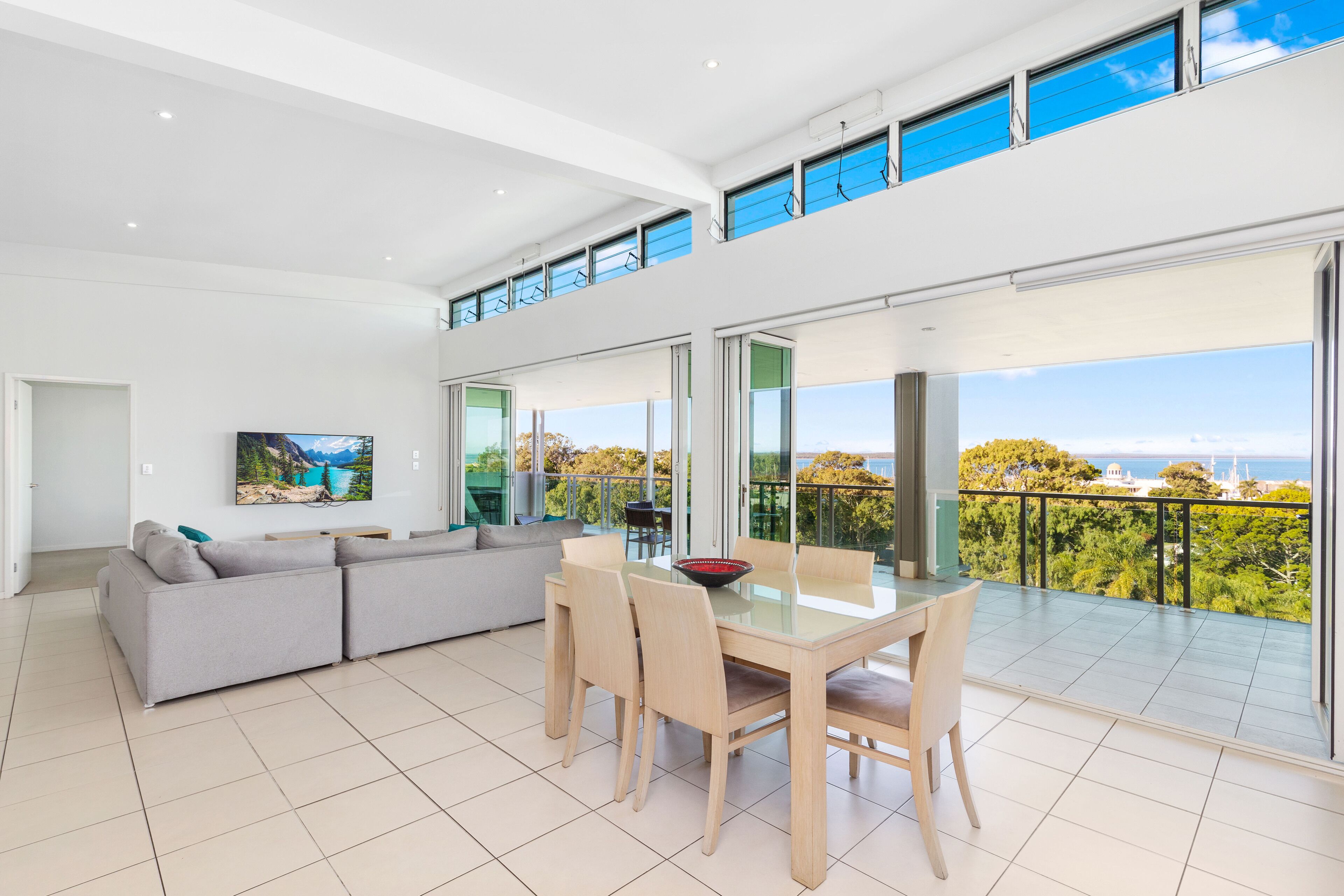 deluxe penthouse | living area | 105-cm lcd tv with cable channels, tv, dvd player