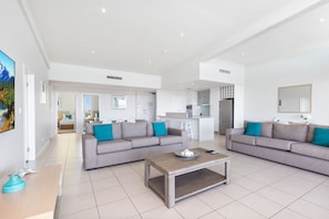 Superior Penthouse | Living area | 105-cm LCD TV with cable channels, TV, DVD player