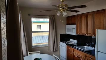 Standard Room, 2 Queen Beds | Private kitchen | Fridge, microwave, coffee/tea maker, toaster