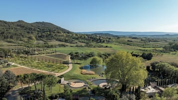 Surrounded by rolling hills and lush vegetation, this serene landscape offers a peaceful escape.