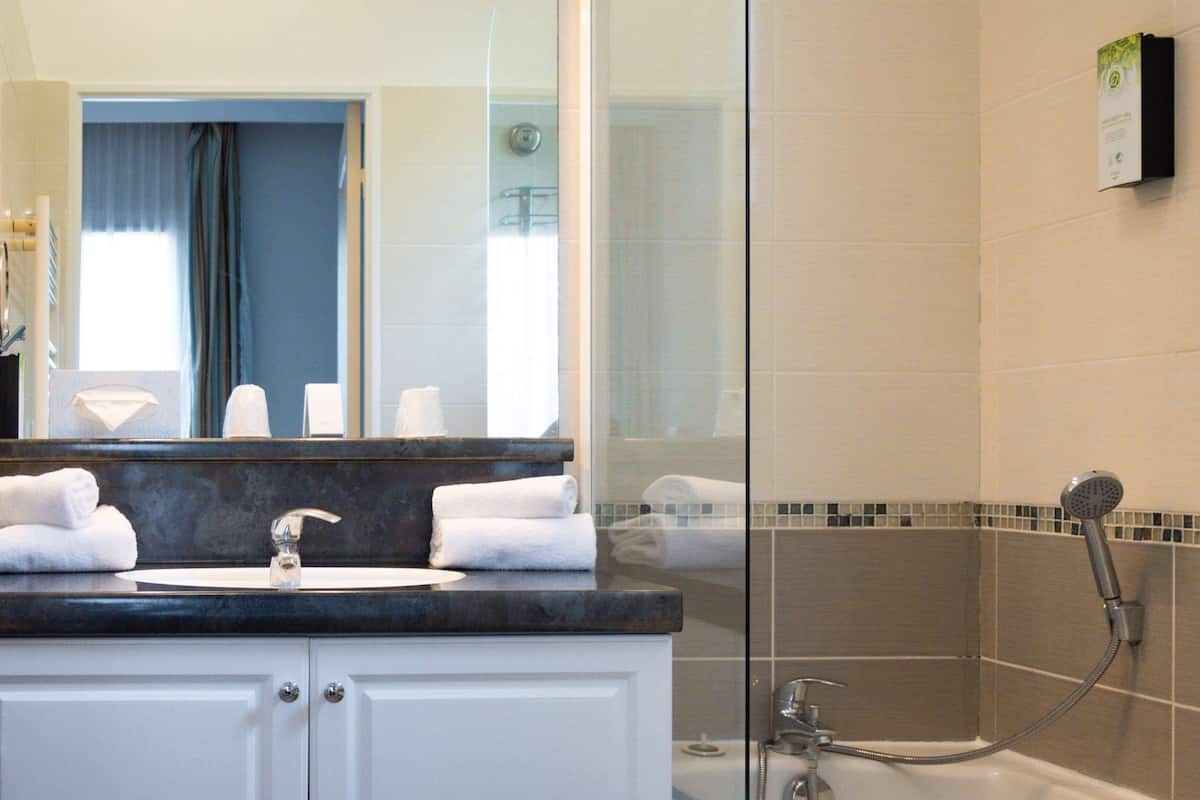 Shower, eco-friendly toiletries, hair dryer, towels