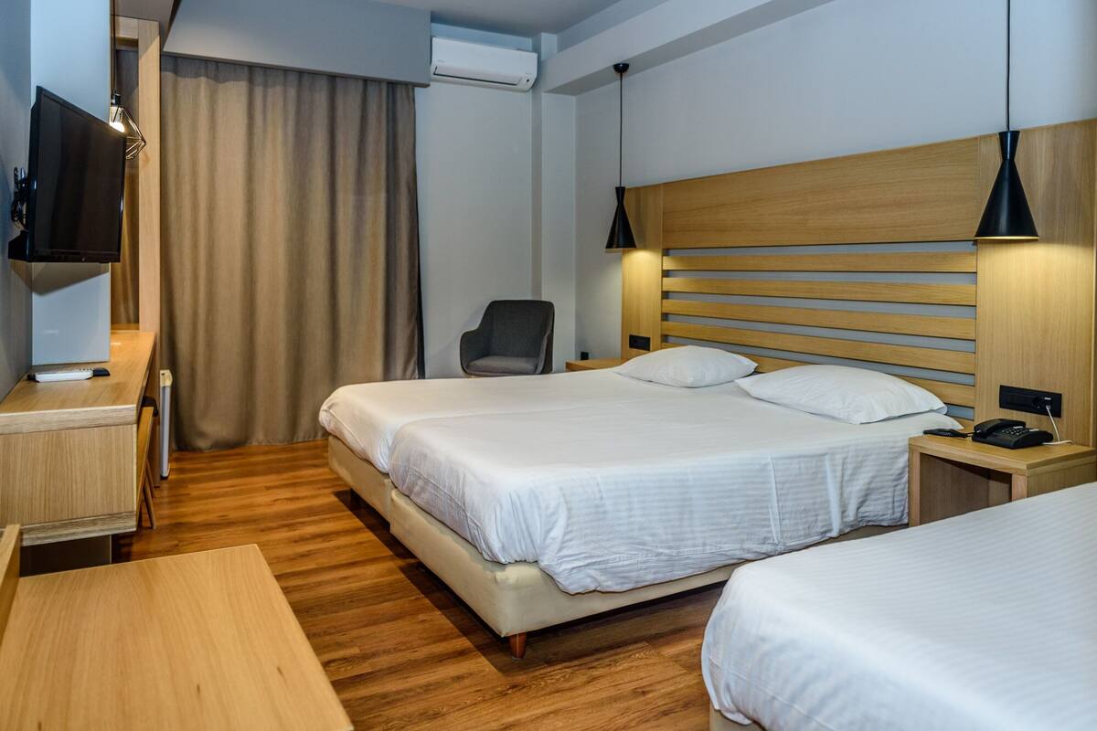 Standard Triple Room, Partial Sea View | In-room safe, WiFi (free), bed sheets
