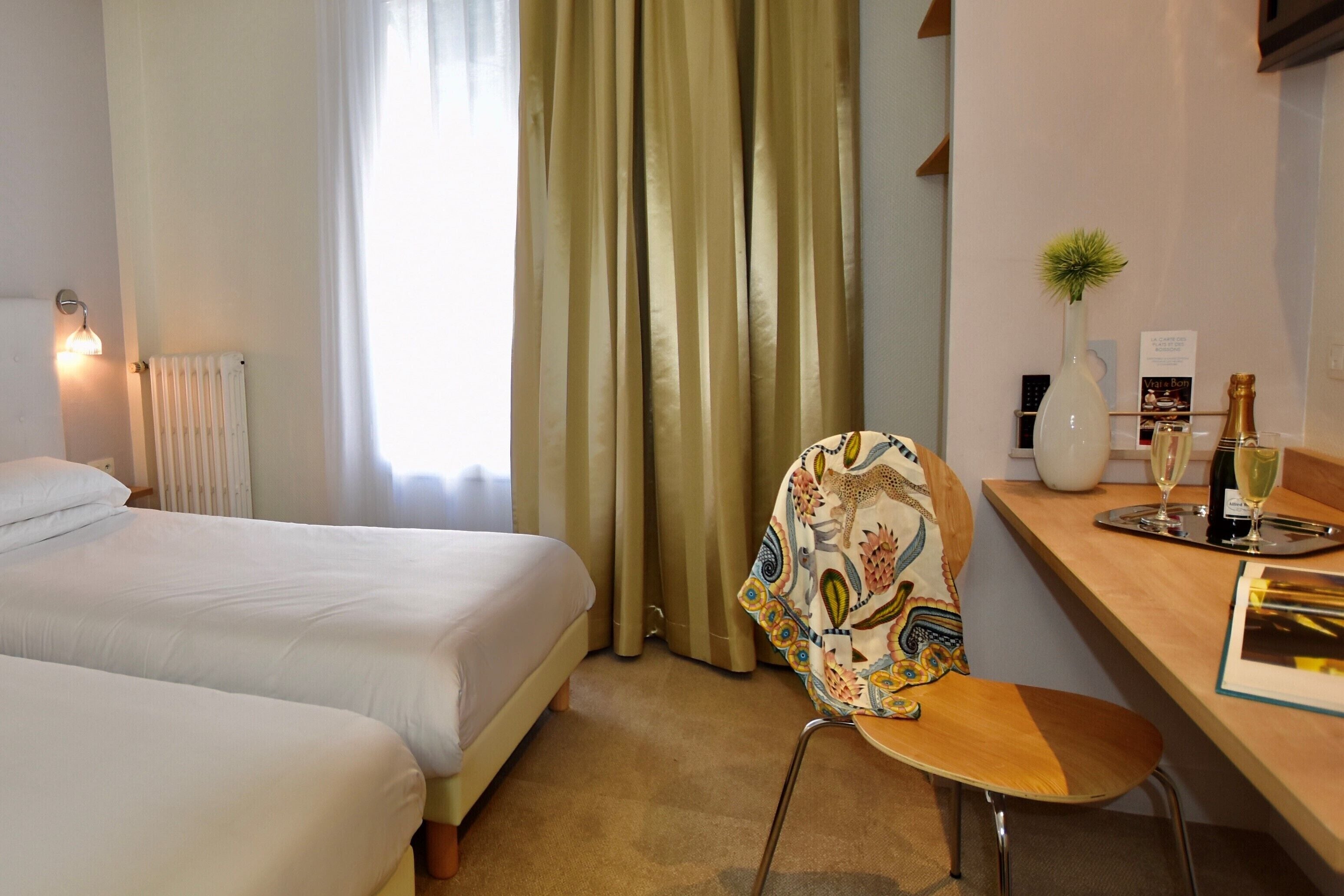 comfort twin room | premium bedding, desk, blackout curtains, soundproofing