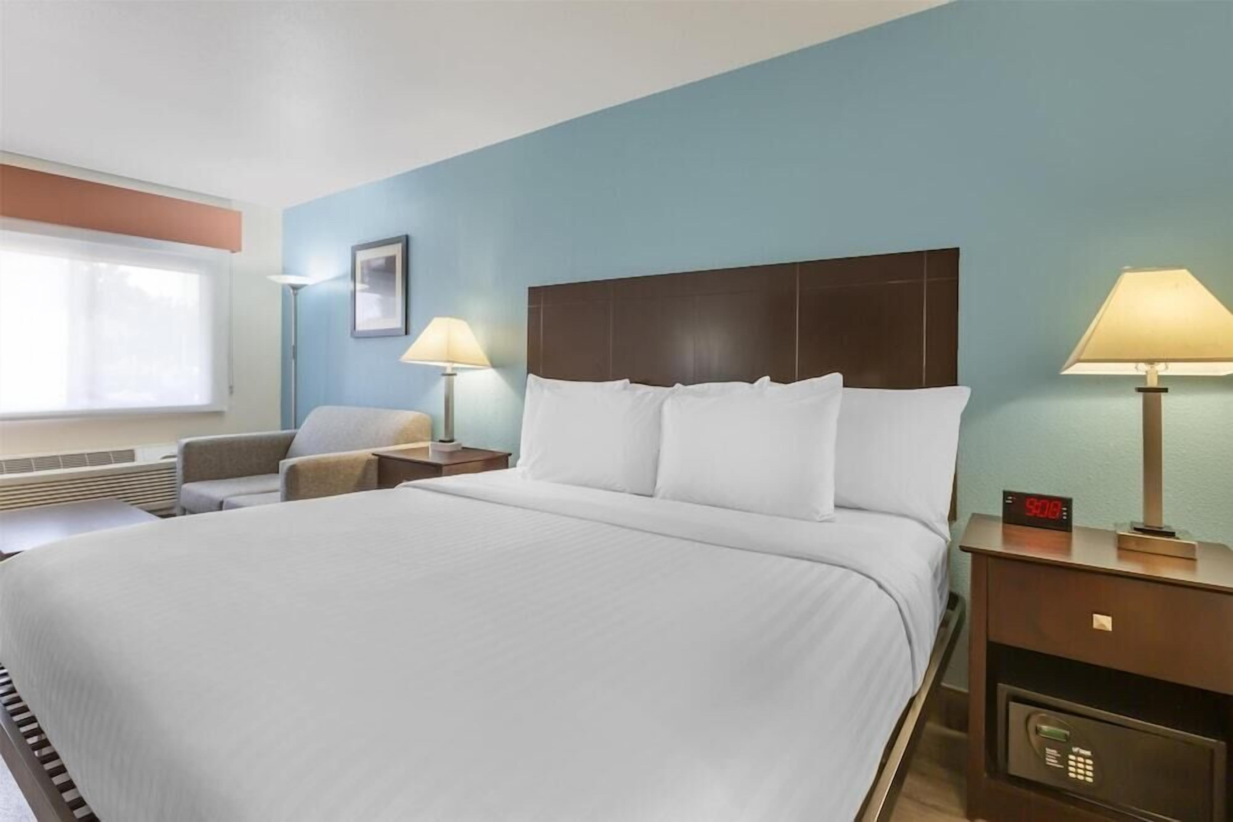 Premium bedding, down duvets, pillow-top beds, in-room safe