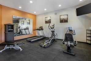 A gym with treadmills, an elliptical, and a bench. - Best Western Copper Hills Inn (Globe)