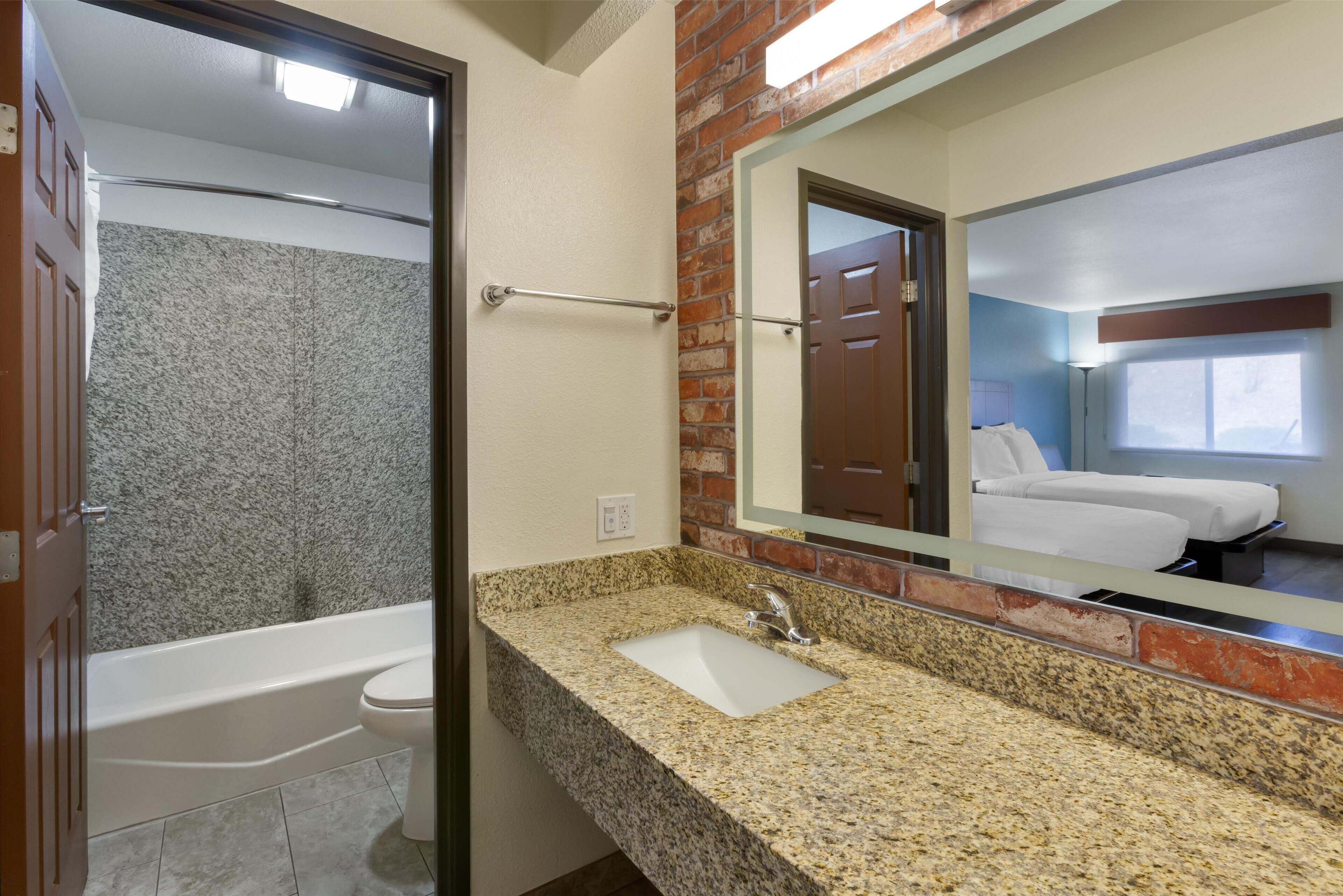 standard room, 2 queen beds, non smoking, refrigerator & microwave | bathroom | deep-soaking bathtub, hydromassage showerhead, free toiletries