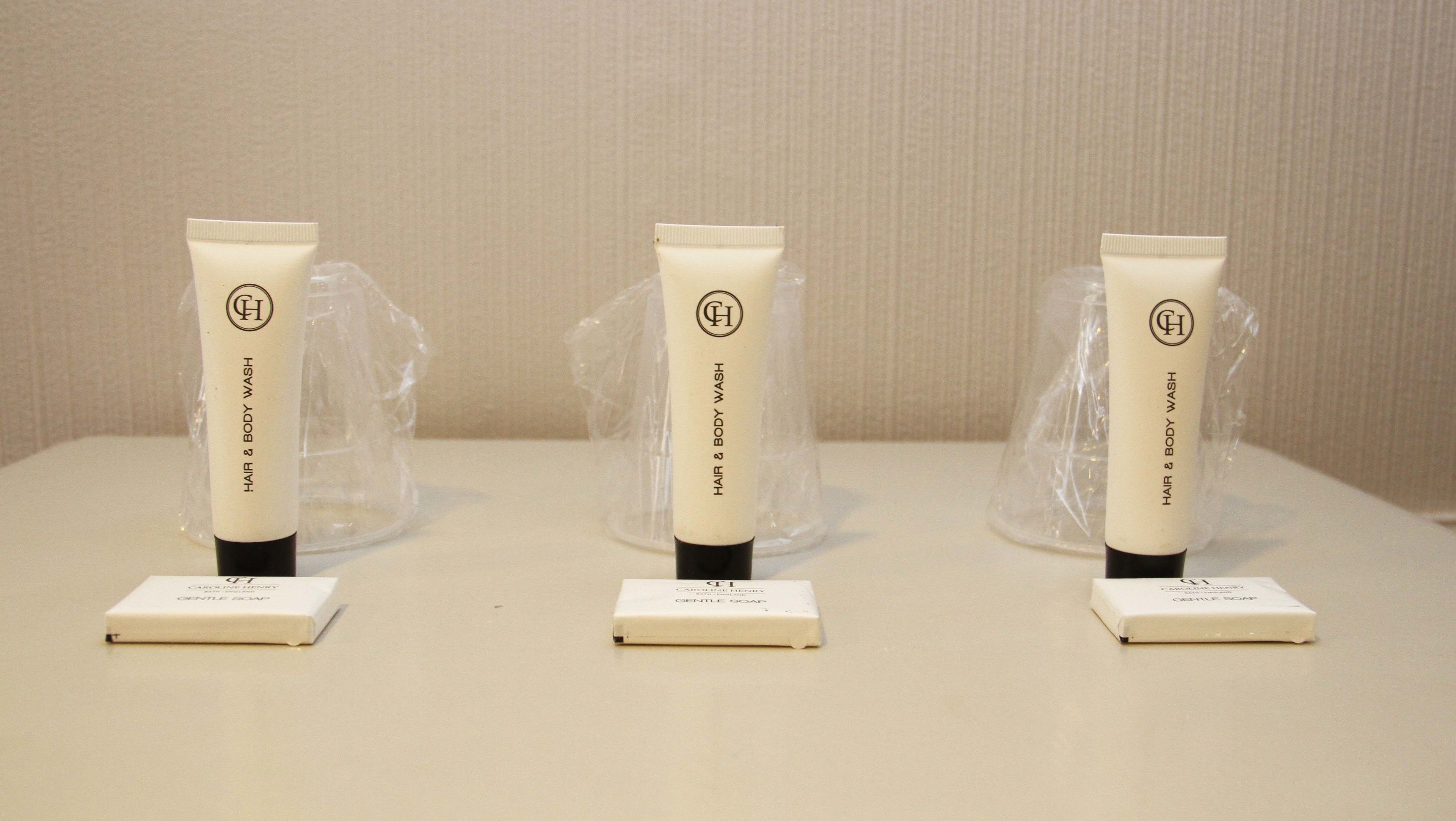 combined shower/bathtub, designer toiletries, hair dryer, towels