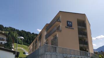 A multi-story hotel with balconies and a sign reading "BLUE TUI BLUE".