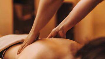 A person receiving a back massage.