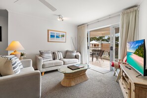 Standard Apartment, 3 Bedrooms | Living area | 55-cm Smart TV with digital channels, TV - Serenity Apartments Noosa (Noosa Heads)